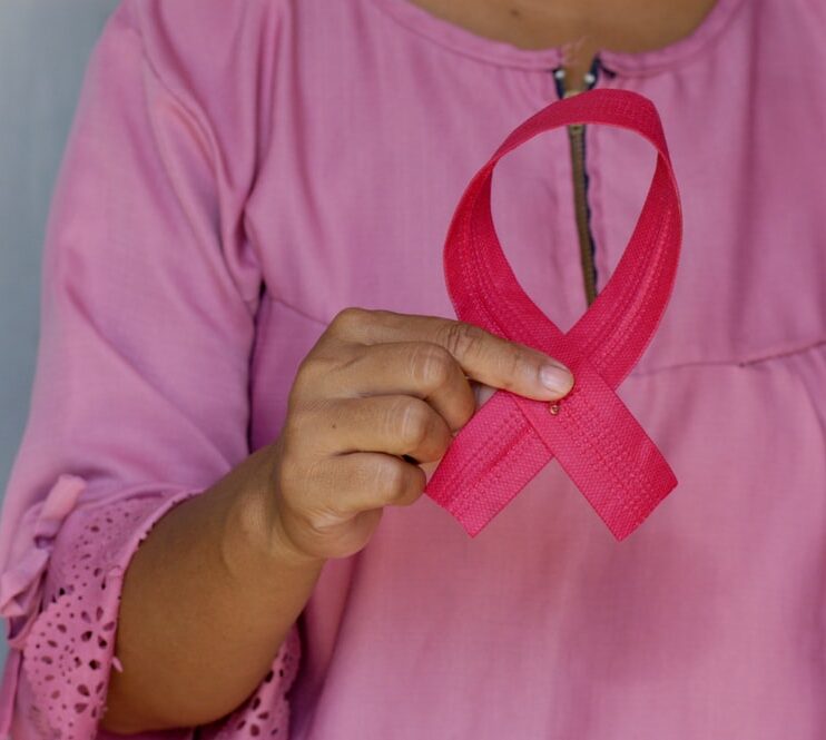 Woman with Cancer Ribbon in Hand