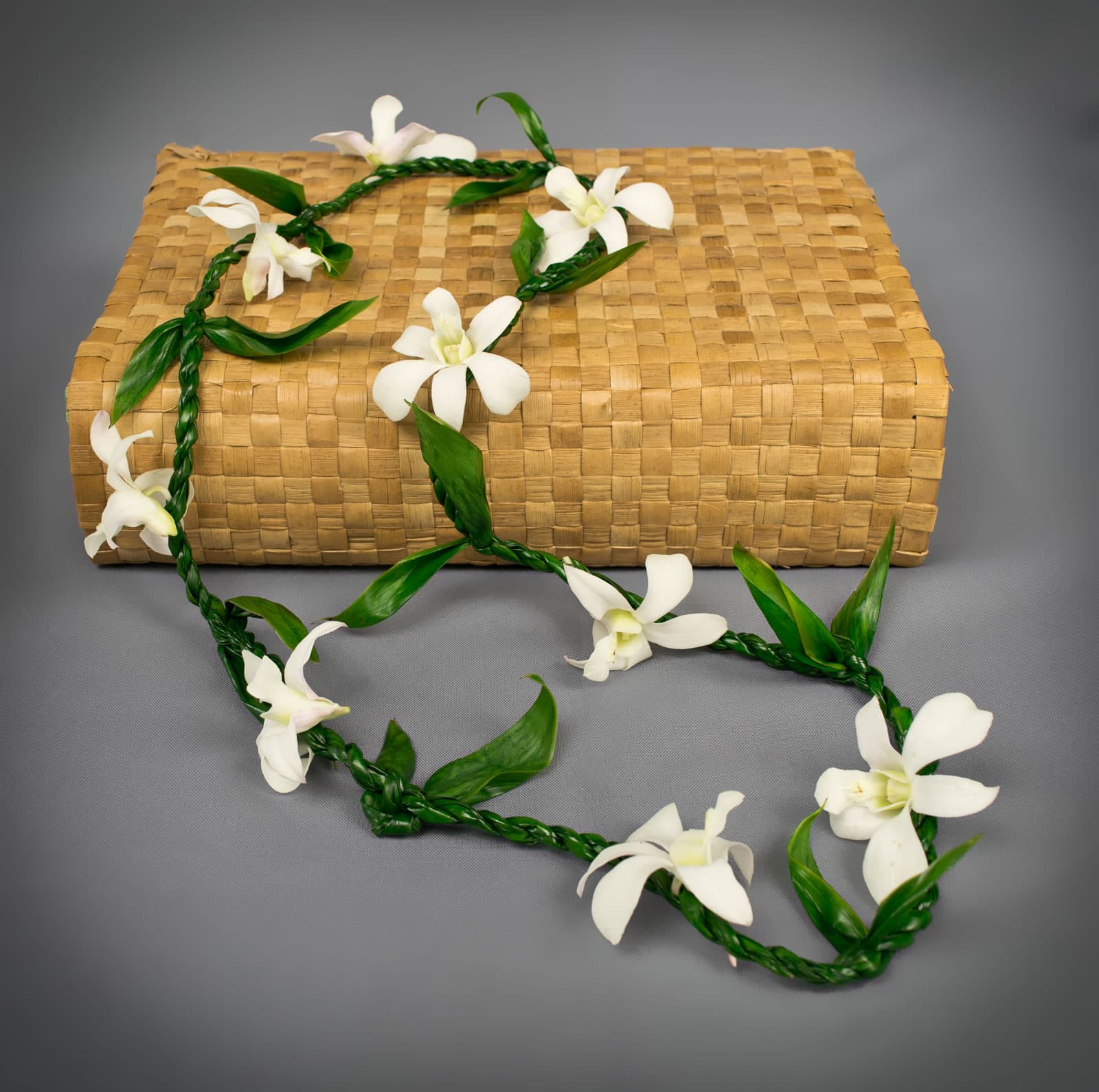 Garland made of Ti leaf and Orchid