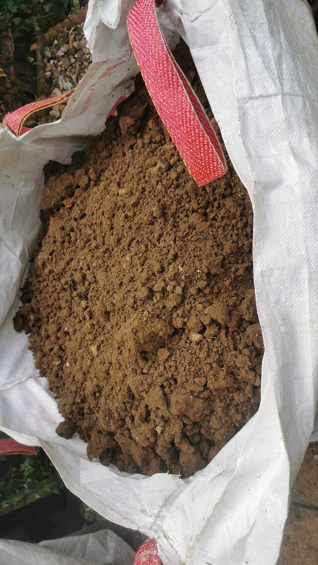 Image represent a bag full of normal garden soil