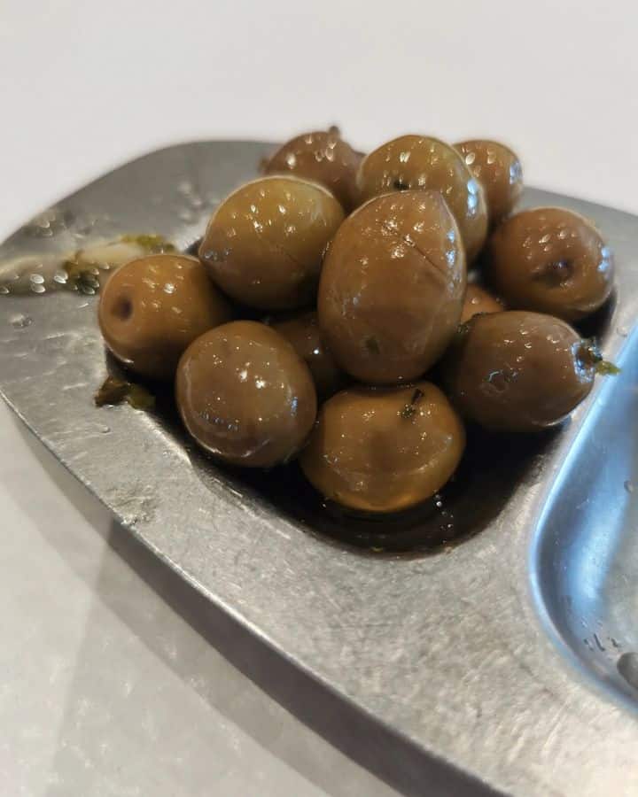 Brown olives flesh over a plate